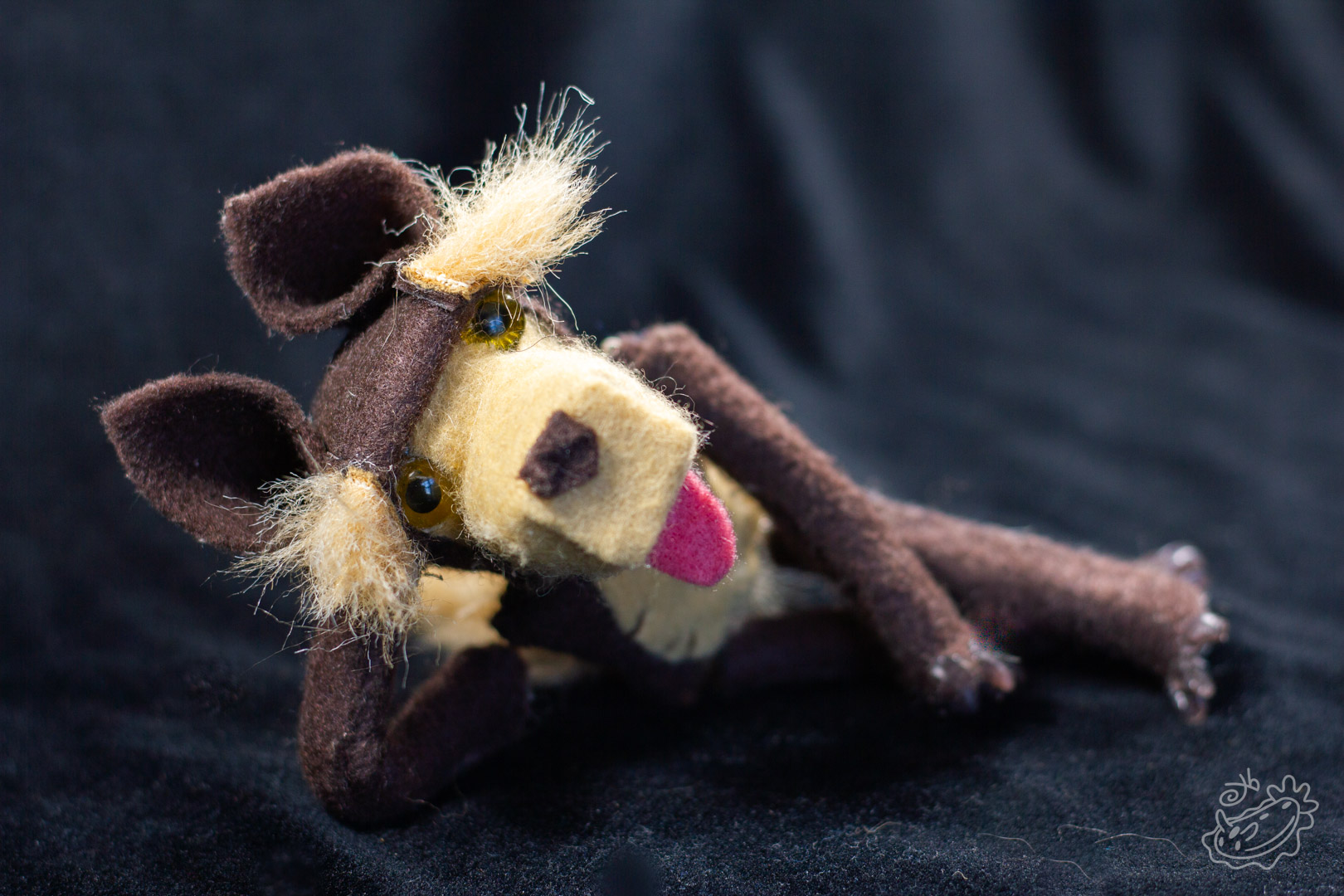A felt doll of the Michigan Dogman. This shot shows the Dogman doll without accessories. Wide View.