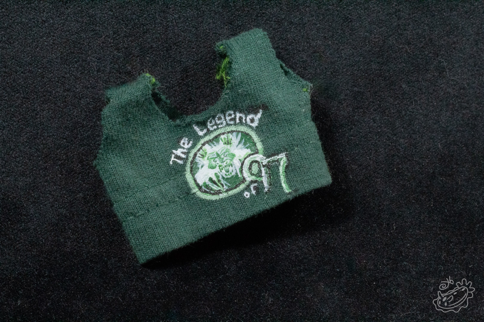 A green tank top in the style of band tee shirts. The design says "The Legend of '97" and has artwork of the Dogman.
